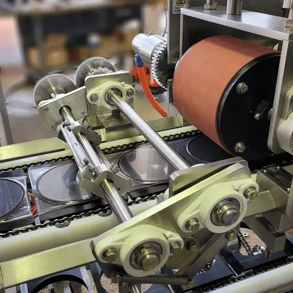 This is a 3D rendering of an FEMC Roller Drum Heat sealer for food packaging automation equipment.