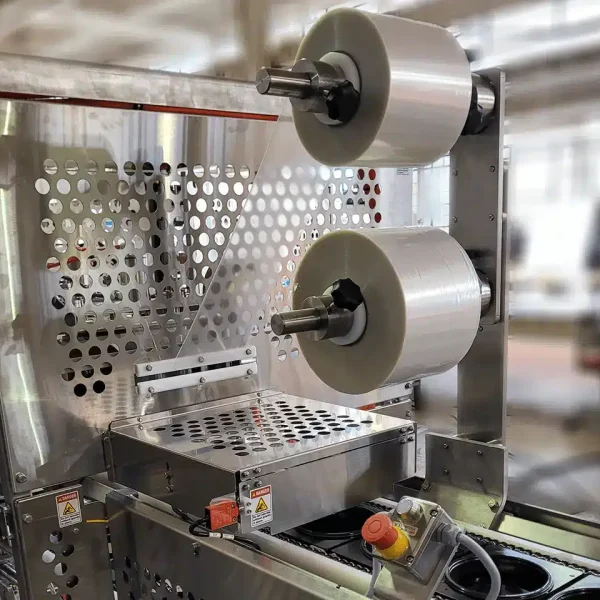 This is a 3D rendering of an FEMC Roller Drum Heat sealer for food packaging automation equipment.